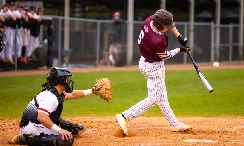 A Franklin High baseball player swings at a pitch.
